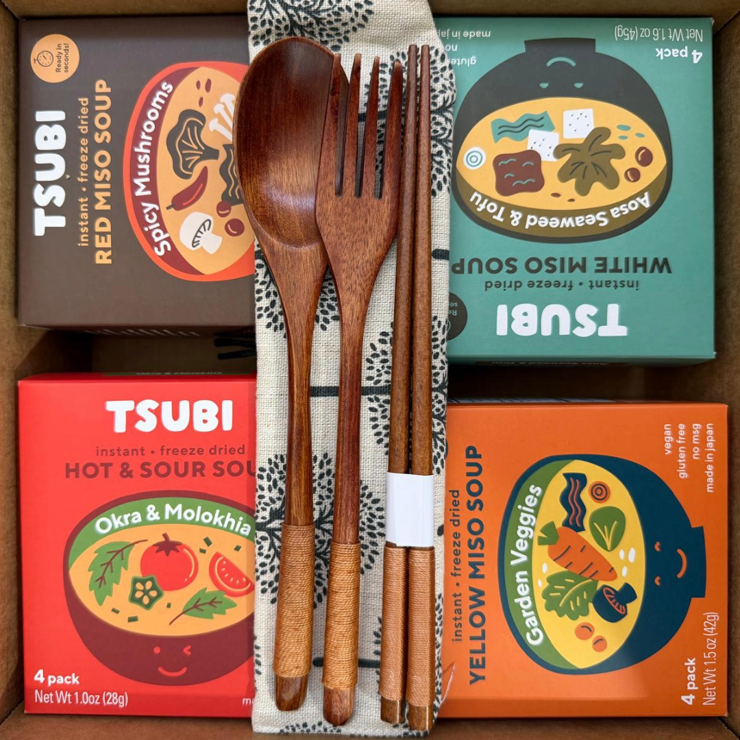 TSUBI instant miso soup packages with wooden cutlery on a wooden surface