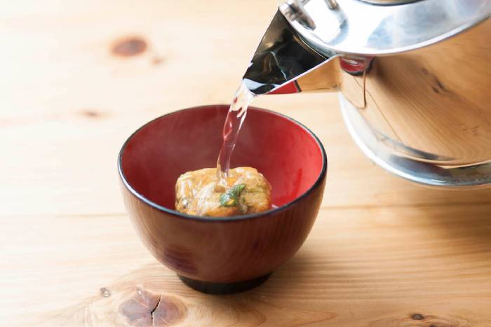 Pouring boiling water on a Japanese instant soup cube